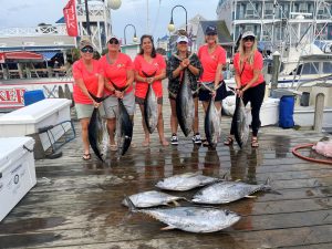 ladies-holding-fish-on-pier.jpg